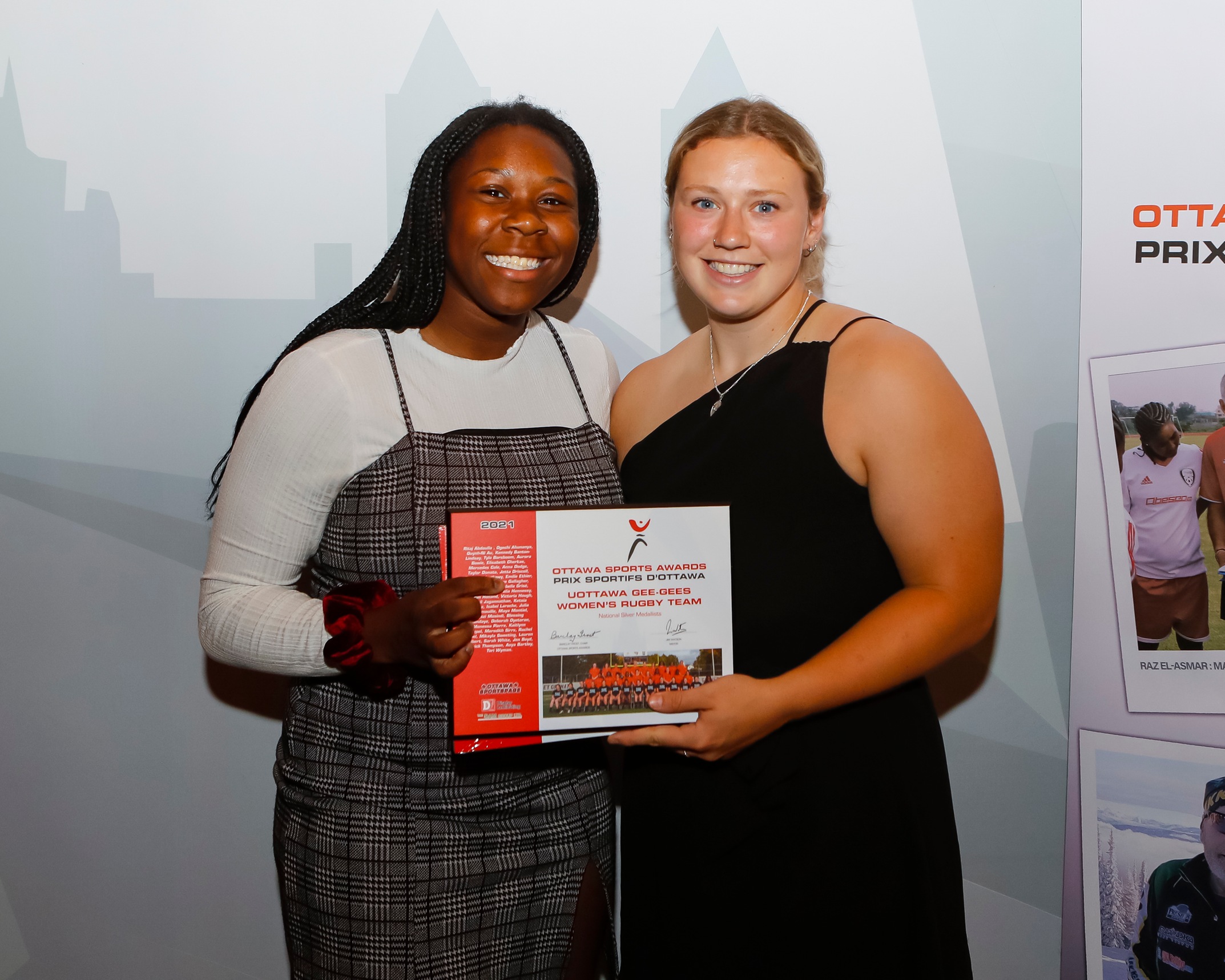 Ngozi Mosindi and Anna Dodge accept the Ottawa Sports Award plaque.
