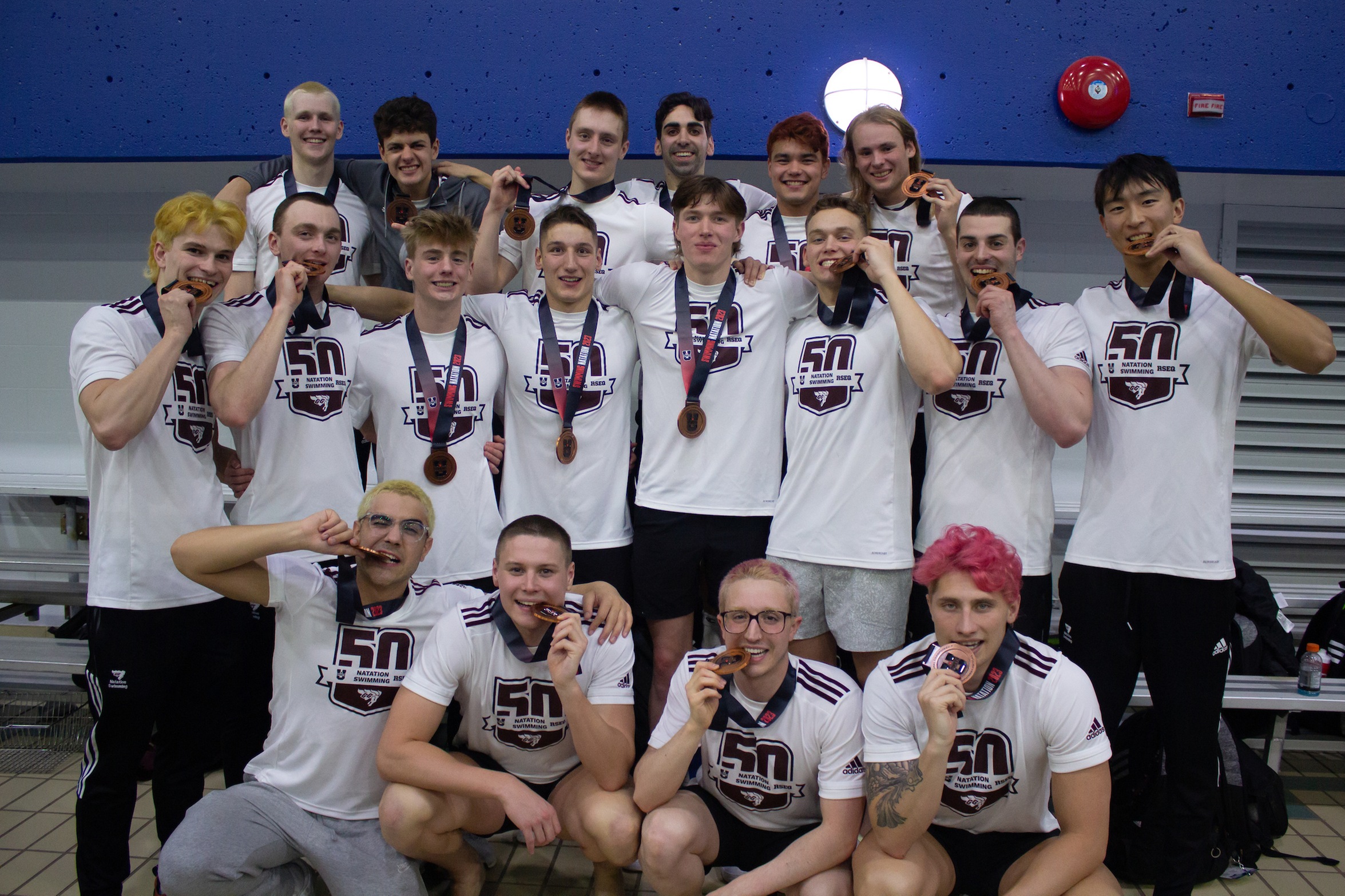 Gee-Gees men's swimming team with their national championship bronze medals.