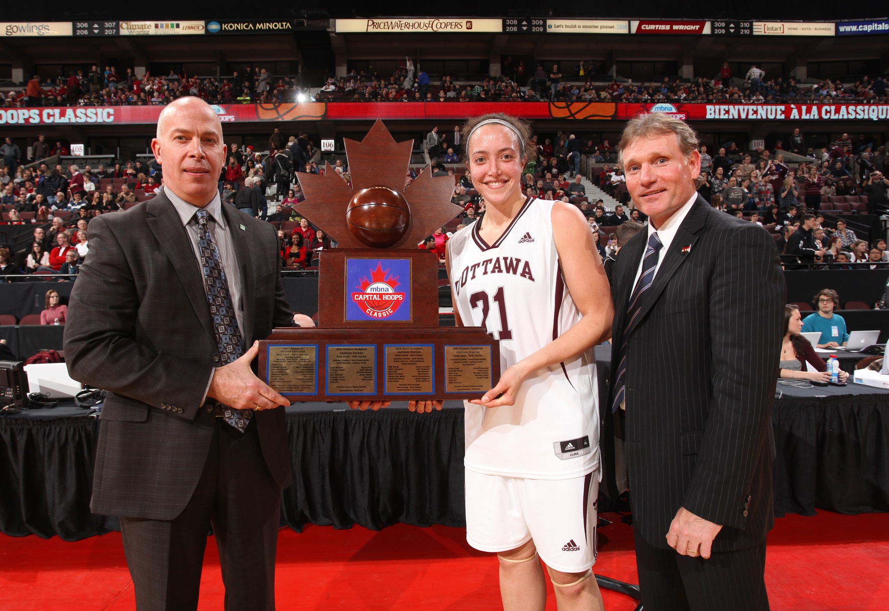 Hannah Sunley-Paisley accepts the Capital Hoops trophy