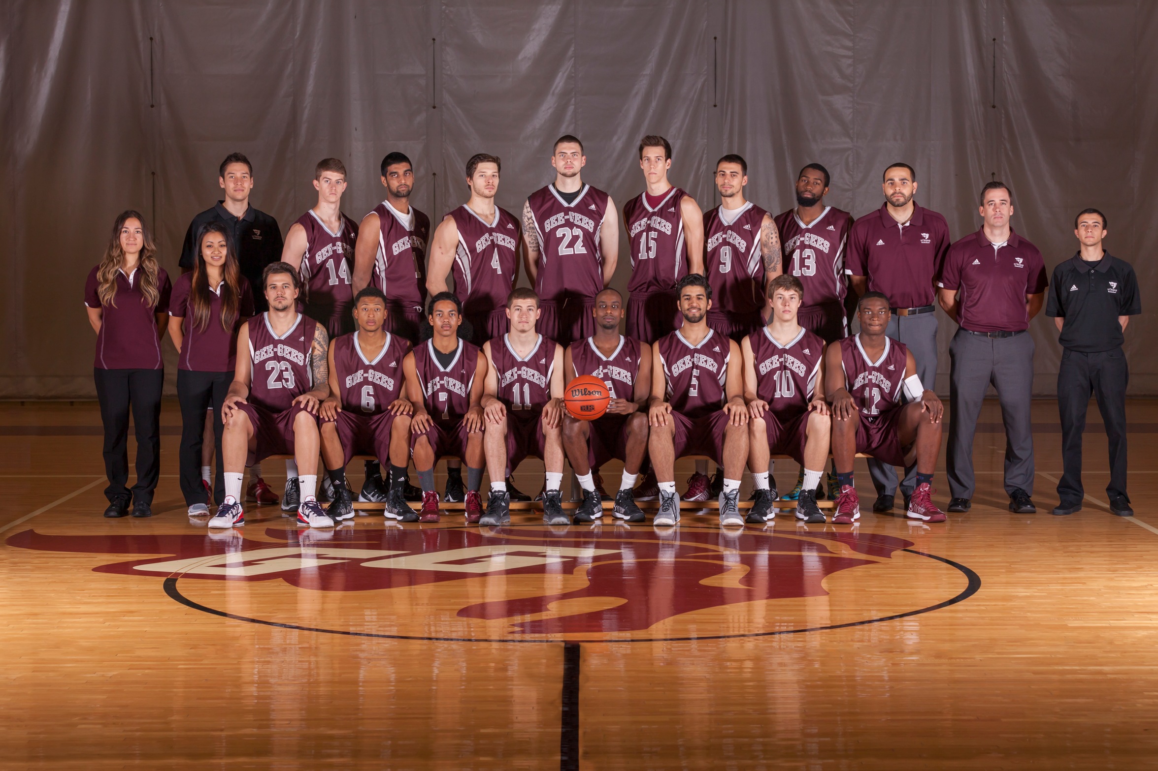 Team photo of the players and staff of the 2013-14 Gee-Gees men's basketball team. Taken in the gym of Montpetit Hall. 
