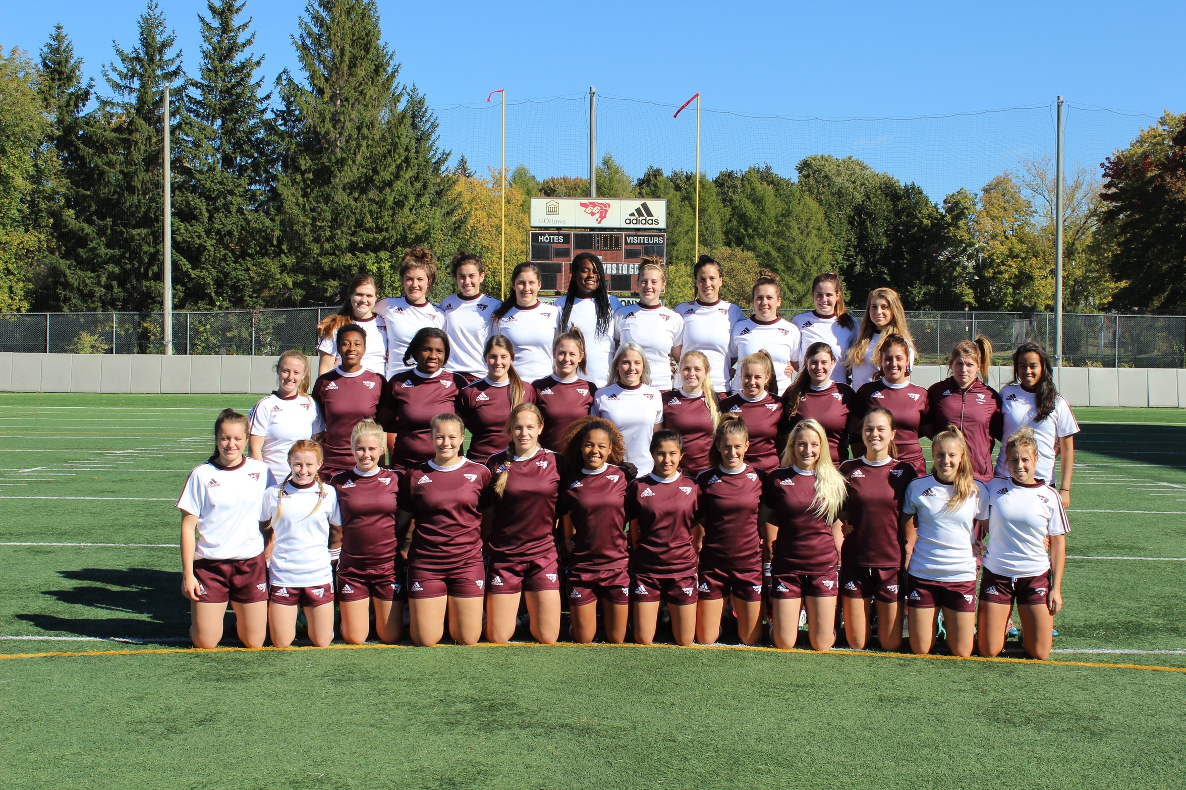 2016 Gee-Gees women's rugby team photo of players taken outside on Matt Anthony Field